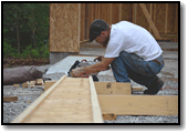 Ricky focused on cutting I-joists for main shop ceiling.